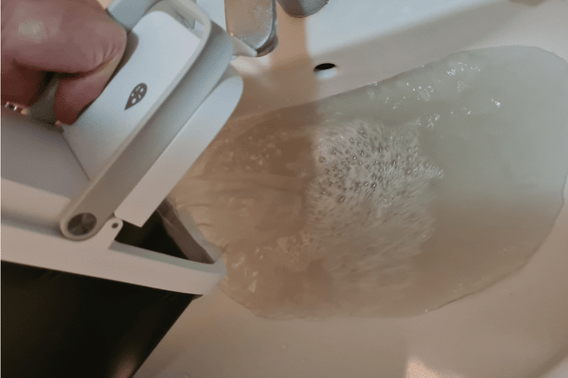 Disposing off the dirty water from the water tank.